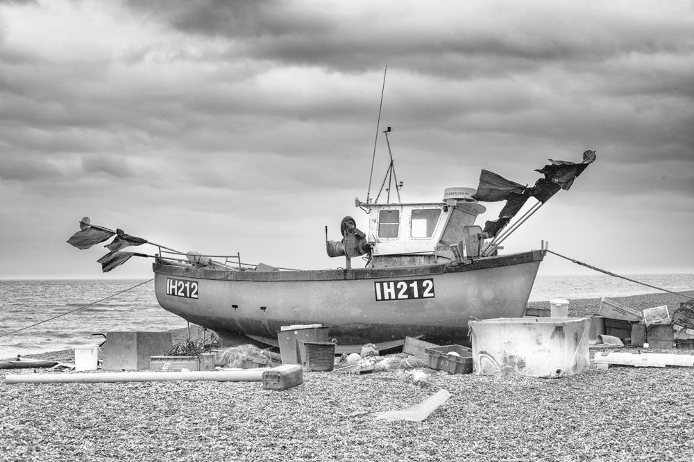 Boat in the rocks - A W Hanson IMAGES