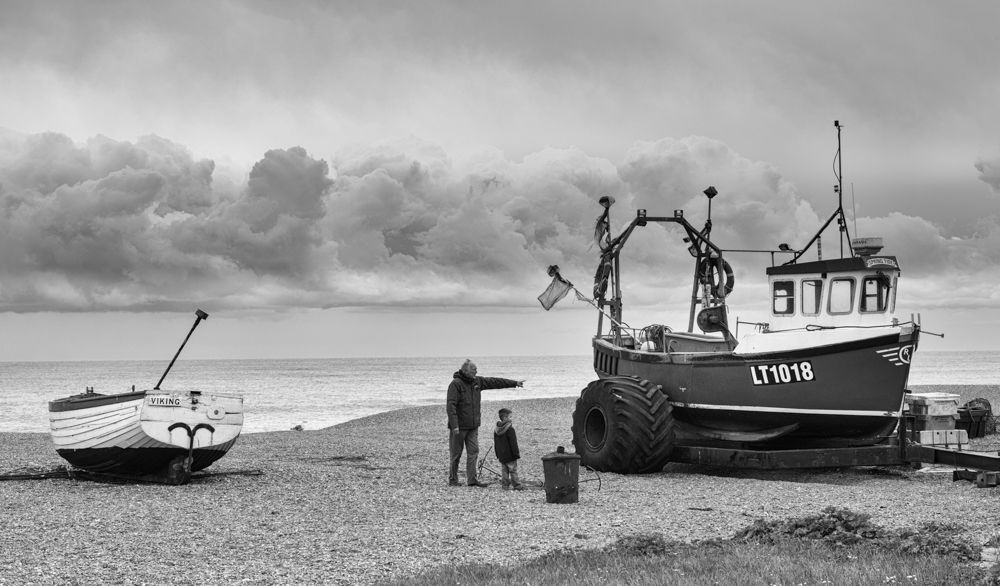 Adult and boy with boat - A W Hanson IMAGES